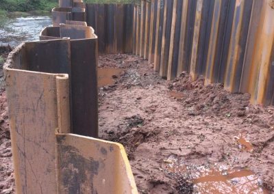 Sheet piling in place for the channel